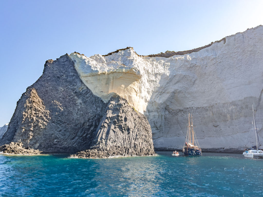 volcanic layers milos greece - laugh travel eat
