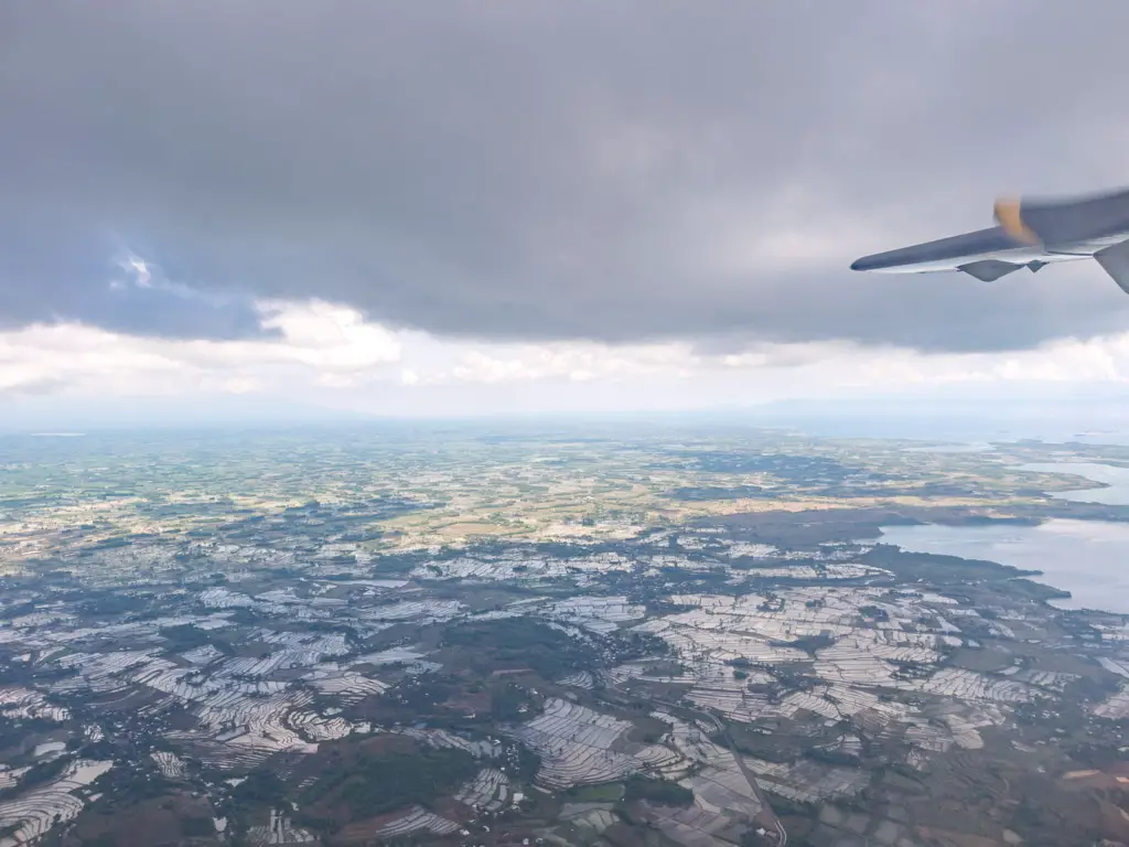 flying over lombok indonesia - laugh travel eat