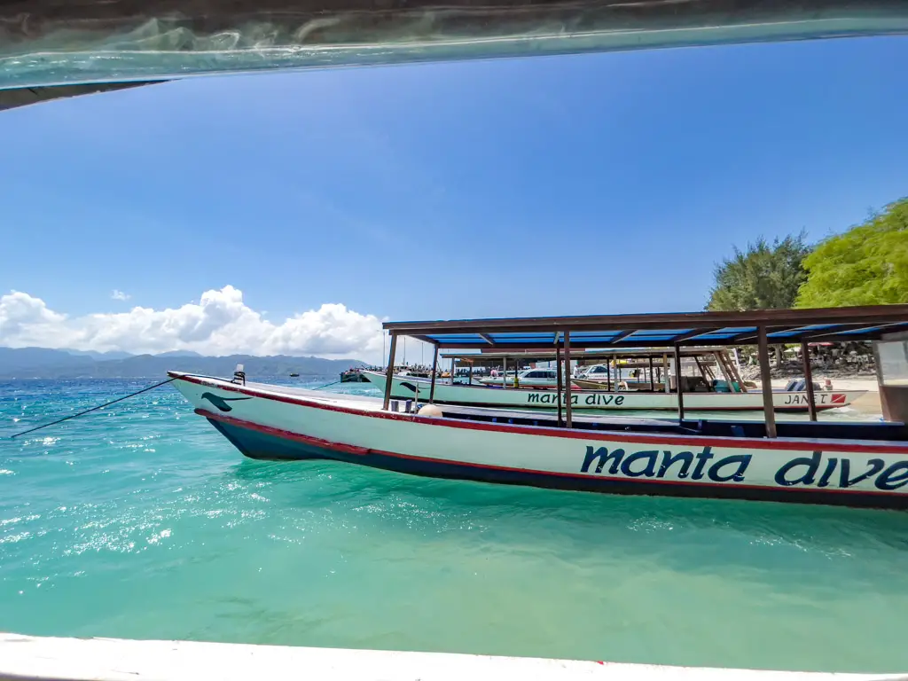 local long boats gili islands lombok indonesia - laugh travel eat