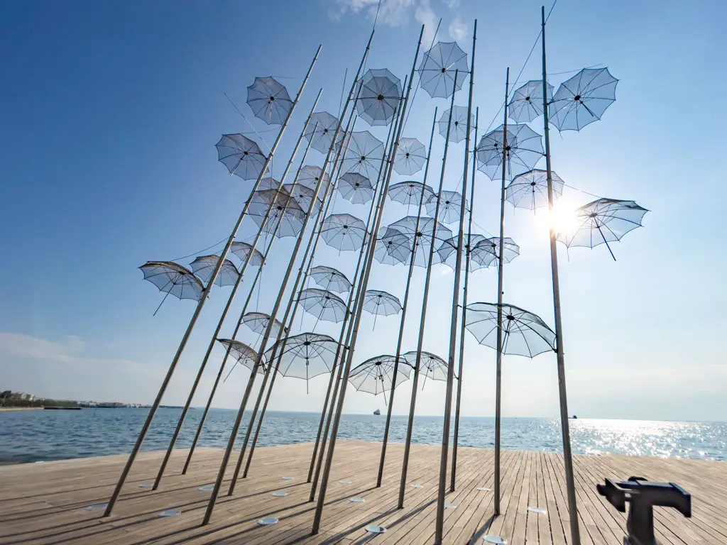 umbrella by the sea thessaloniki greece - laugh travel eat