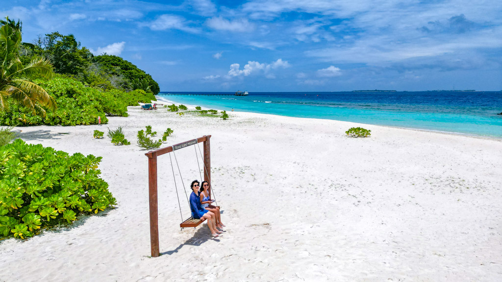 us on a swing royal island Maldives - laugh travel eat