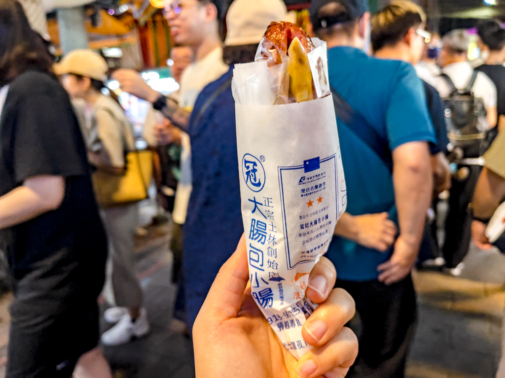 sausage in a sausage shilin night market taipei taiwan - laugh travel eat
