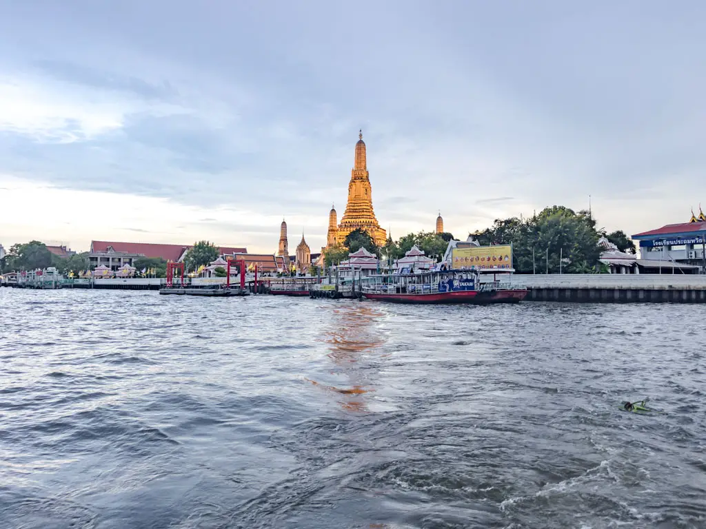 wat arun view from chao phraya river bangkok thailand - laugh travel eat