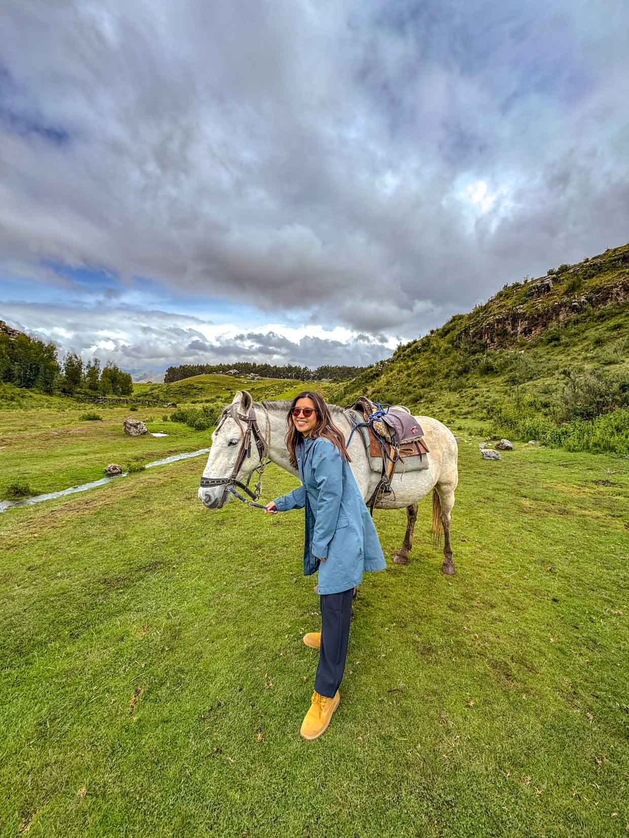 horse riding around ruins in Cusco Peru - laugh travel eat